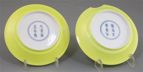 A fine pair of Chinese lemon yellow saucer dishes, Yongzheng mark and possibly of the period, D. 10.8cm, one with section broken, secon